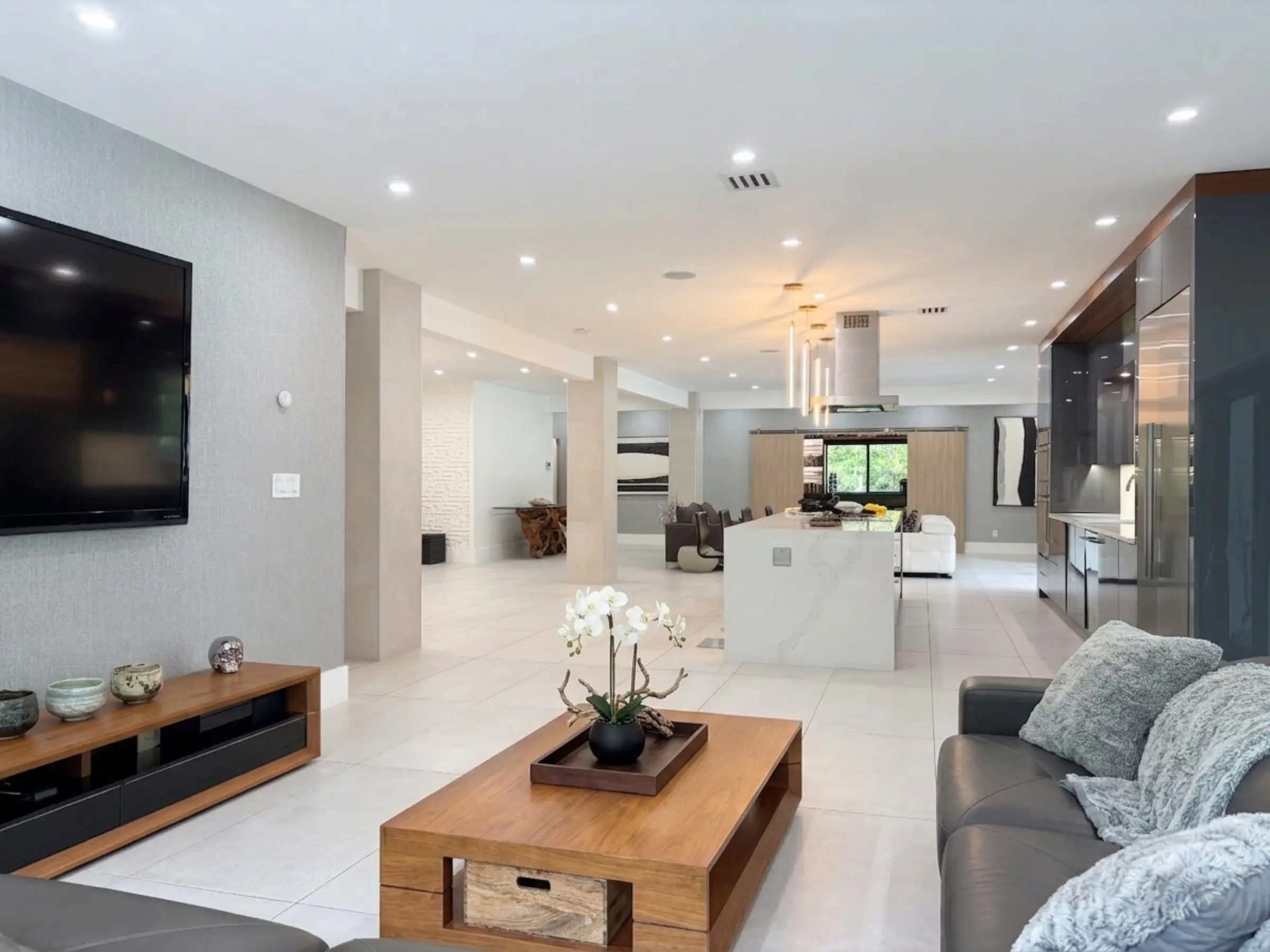Family room opening to the patio through glass doors