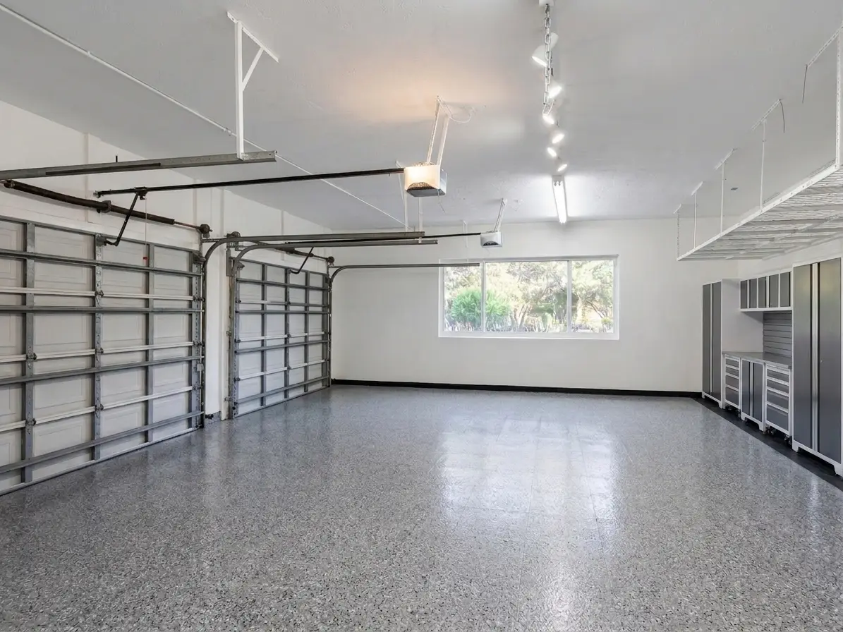 Three-car garage, epoxy floors, built-in cabinetry, large windows